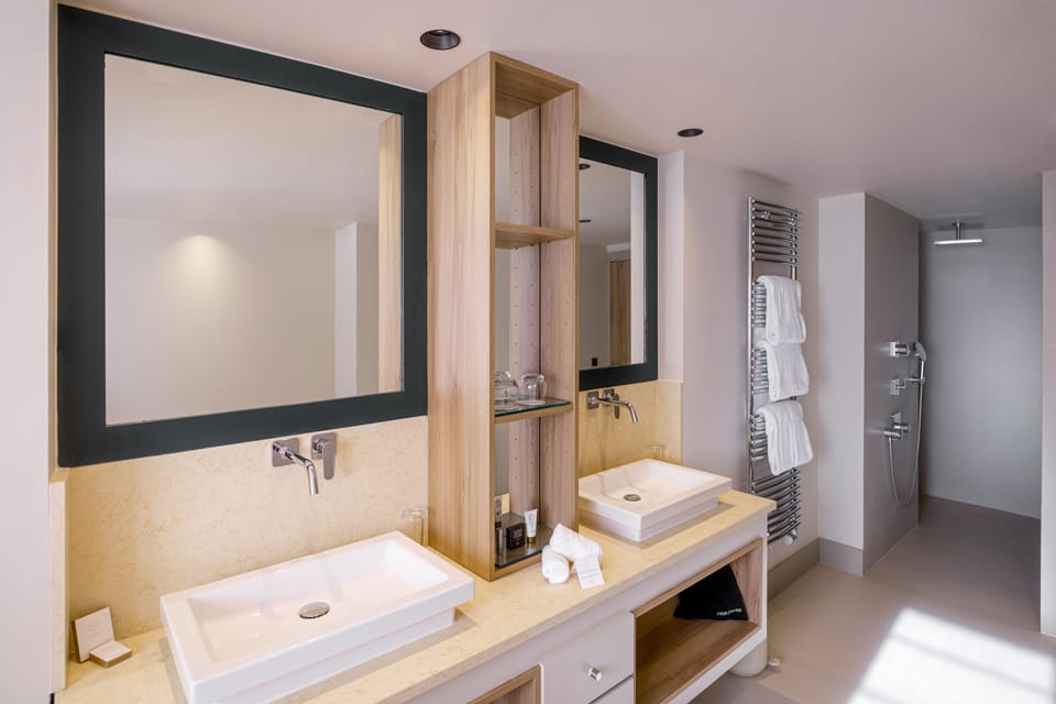 Designer toiletries, hair dryer, bathrobes, slippers