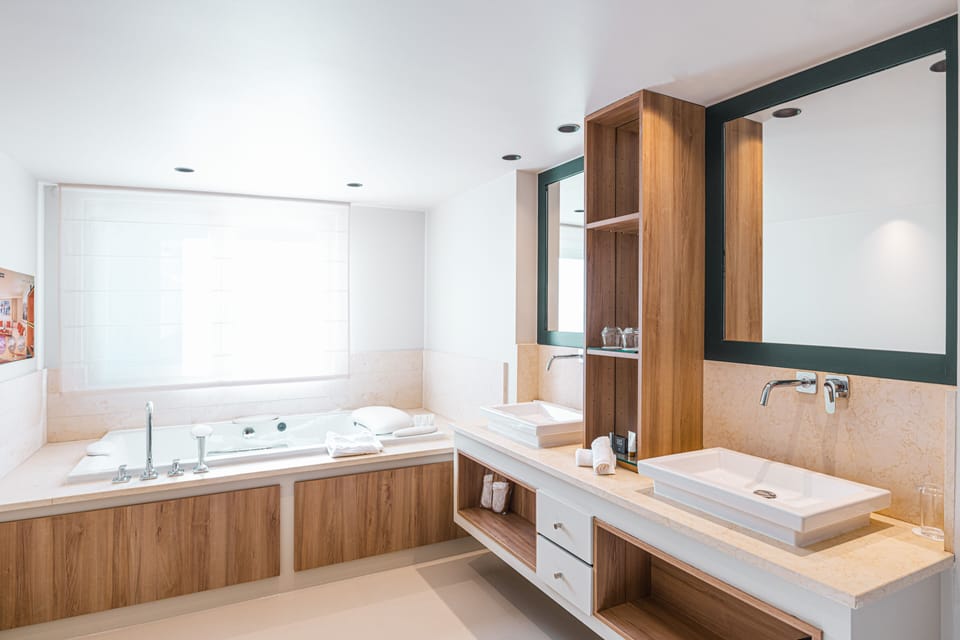 Designer toiletries, hair dryer, bathrobes, slippers