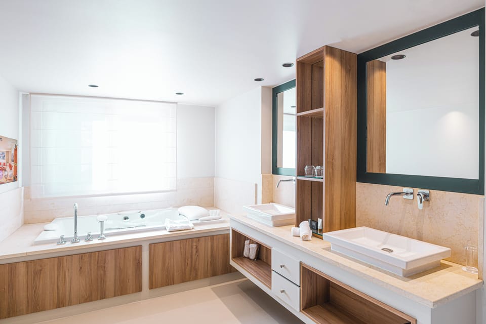Designer toiletries, hair dryer, bathrobes, slippers