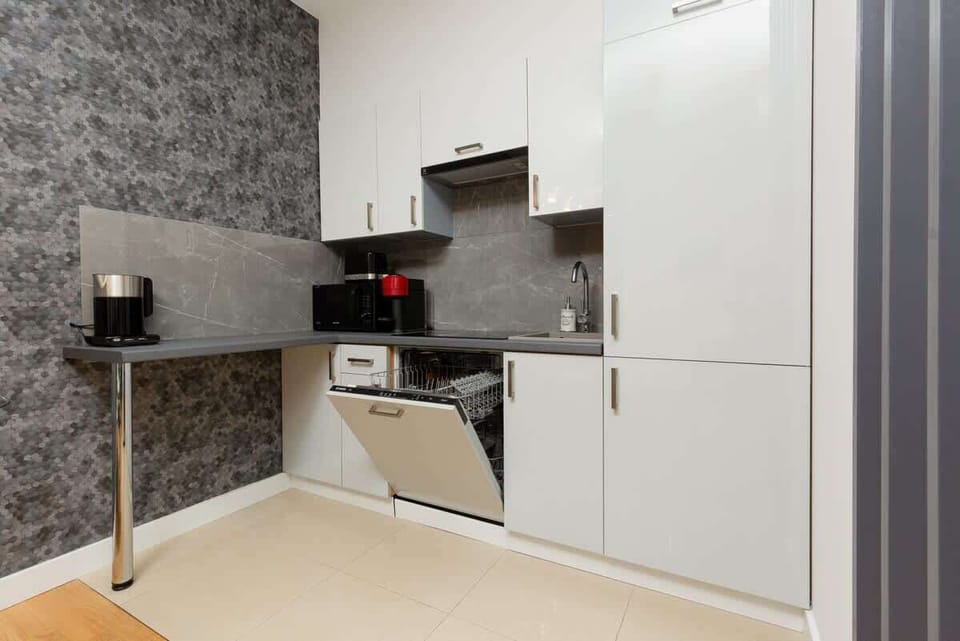 The fully equipped kitchenette includes everything you need for a home-cooked meal.
