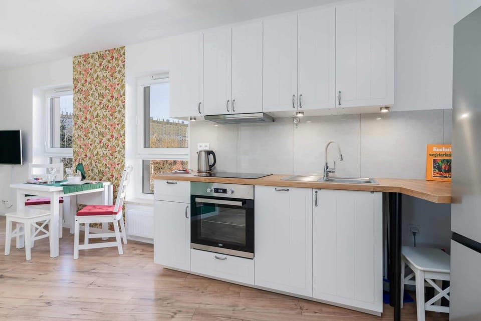 Kitchenette with plenty of kitchen utensils and dishes