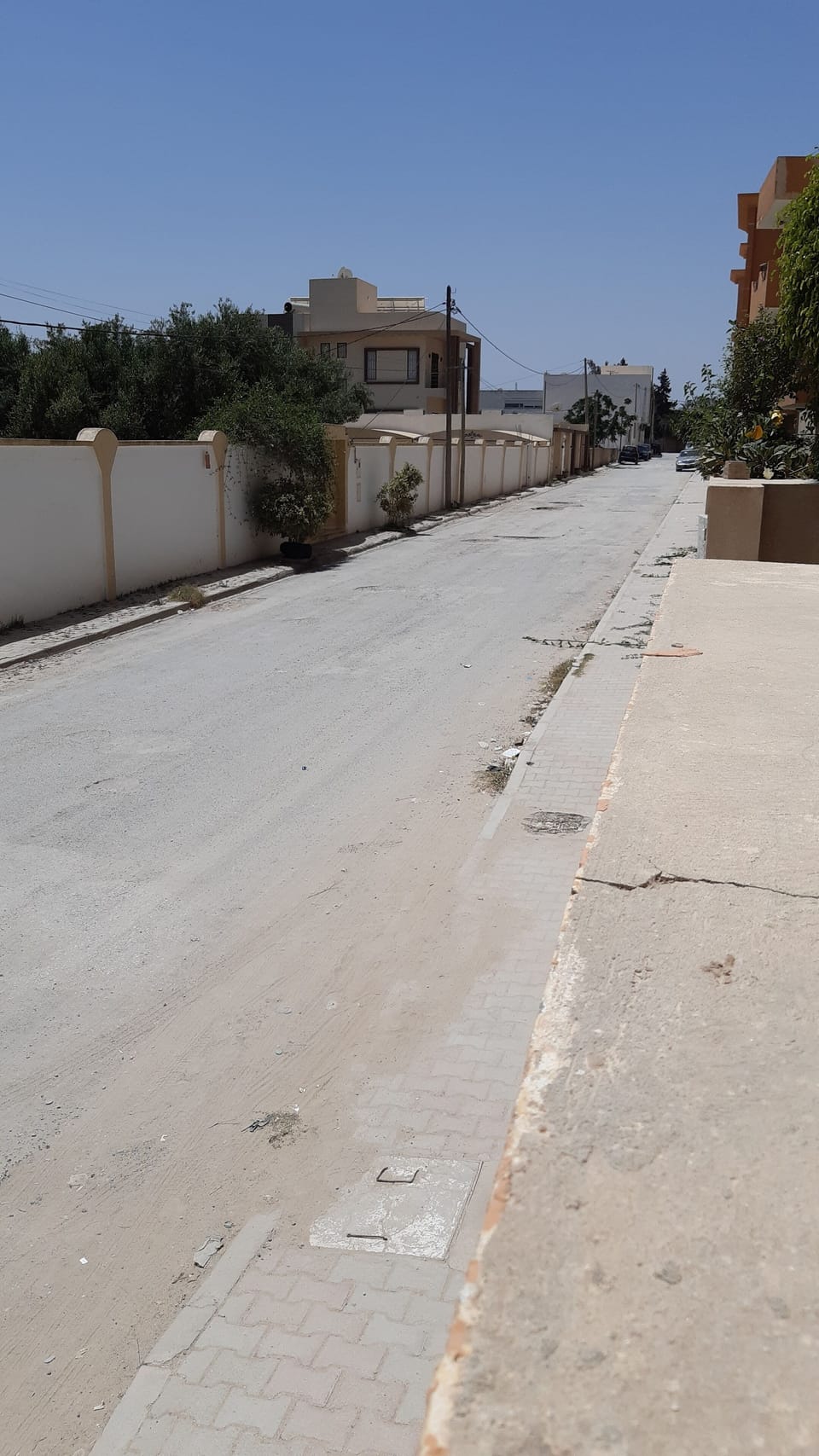 street outside compound, southside.  Free parking under CCTV.