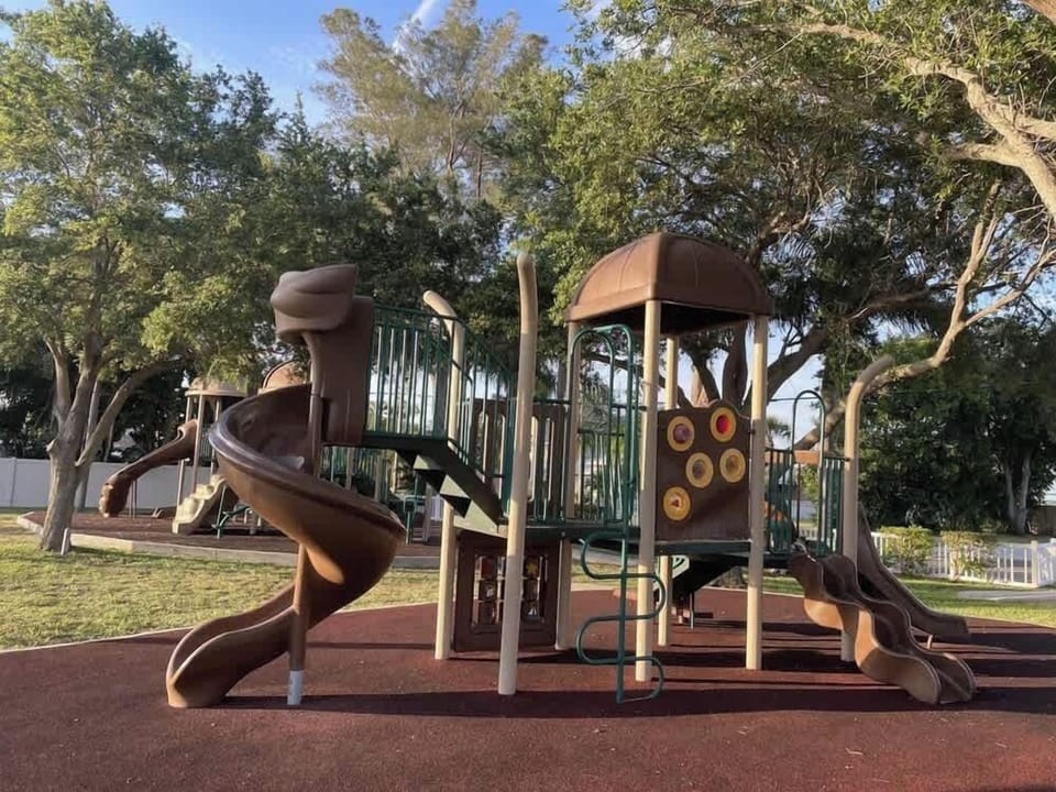 Brown Park is a few minute walk from the house. It includes, two play sets, basketball and tennis courts and some water views.