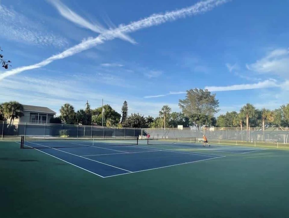 Brown Park is a few minute walk from the house. It includes, two play sets, basketball and tennis courts and some water views.