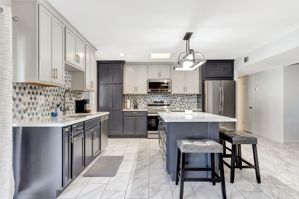 Stainless steel appliances adorn the beautiful kitchen