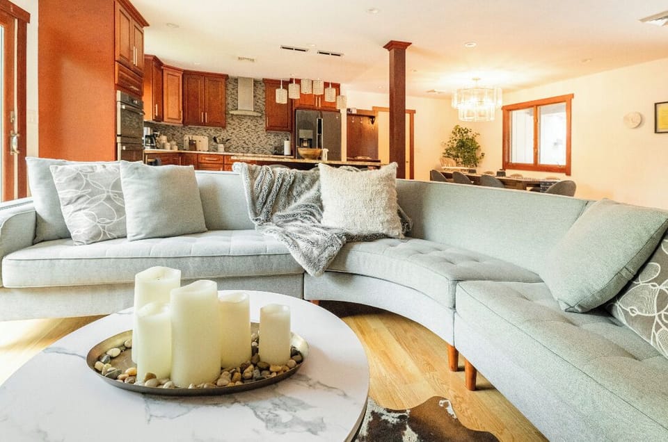 Living room with 85" smart TV and propane fireplace