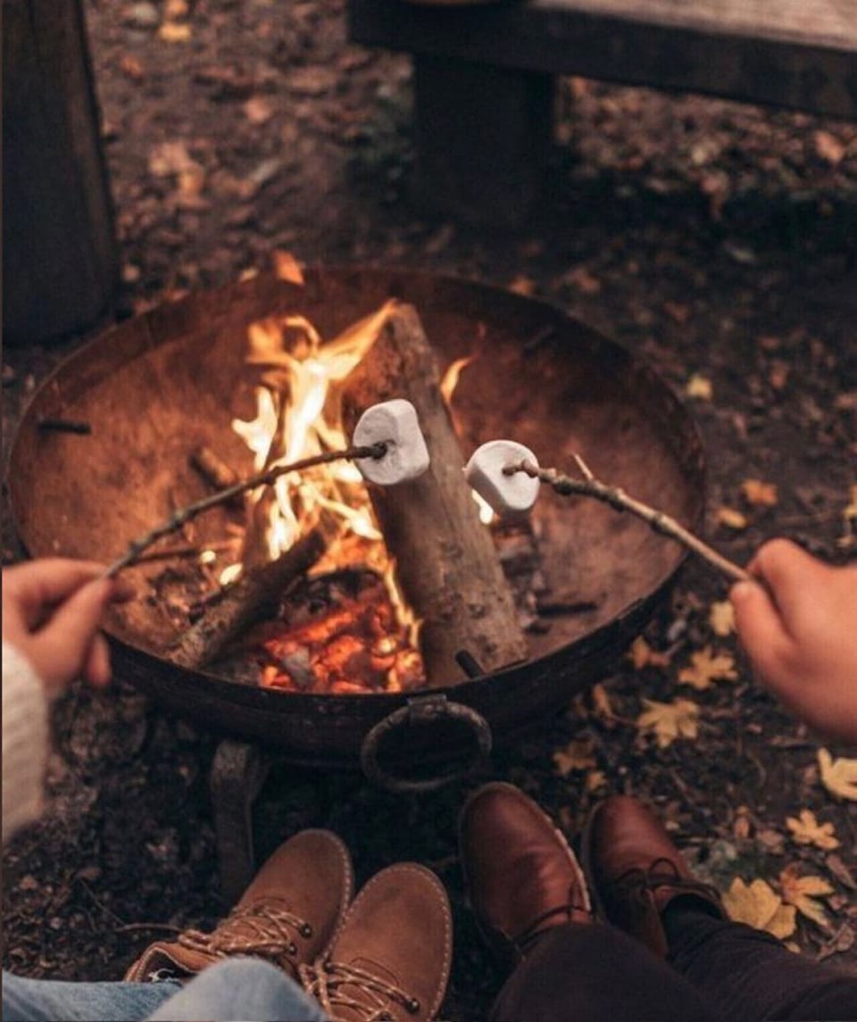 The outdoor fire-pit provides fun, and flavor, for the family!