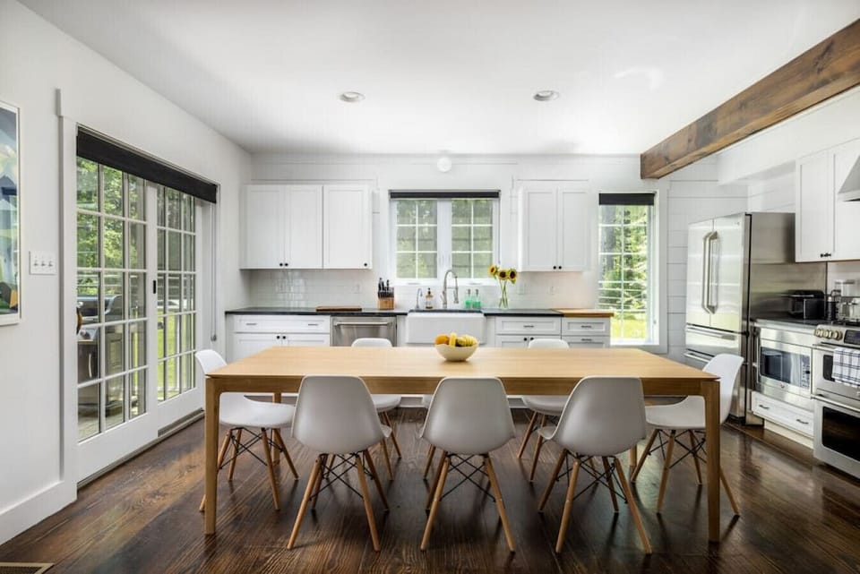 Bright dining area leading into kitchen