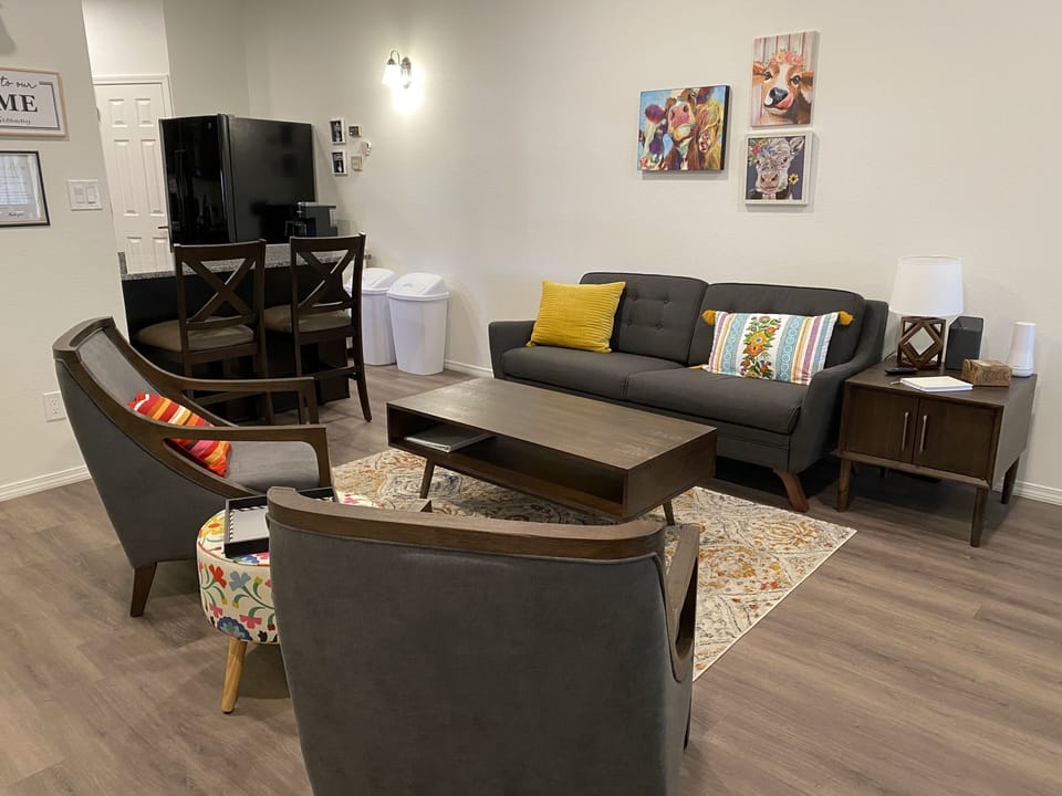 Main floor sitting area with a 50 inch smart TV.