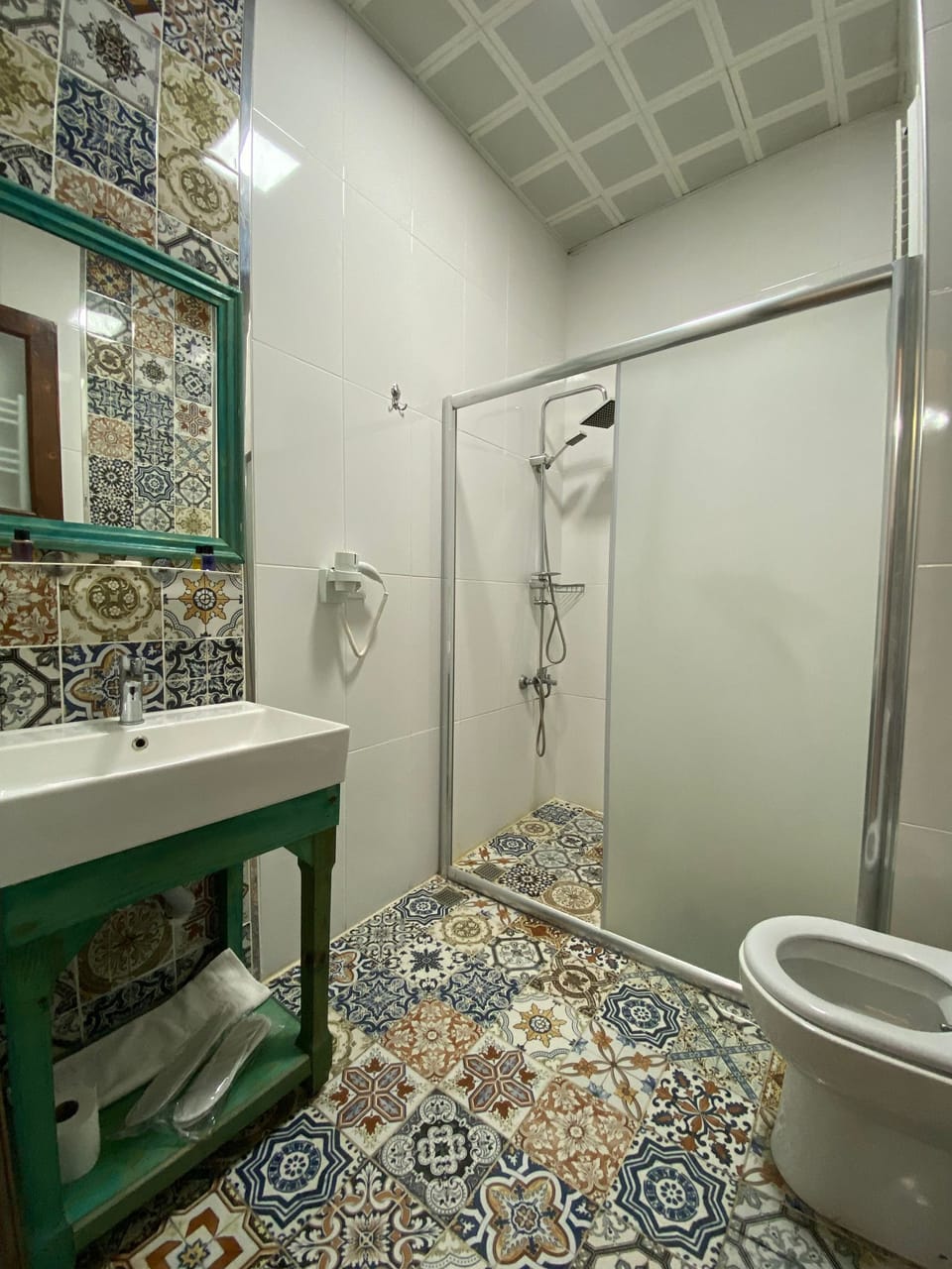 Shower, designer toiletries, hair dryer, towels