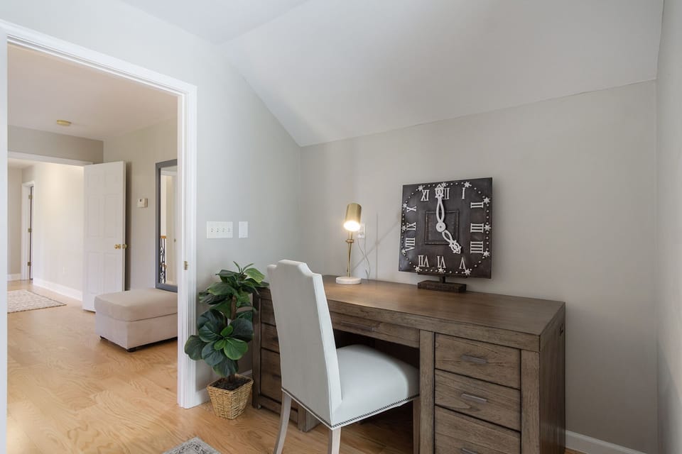 This dedicated workspace is in its own room, yet connects to the primary bedroom! Enjoy ample desk space and a comfortable chair.