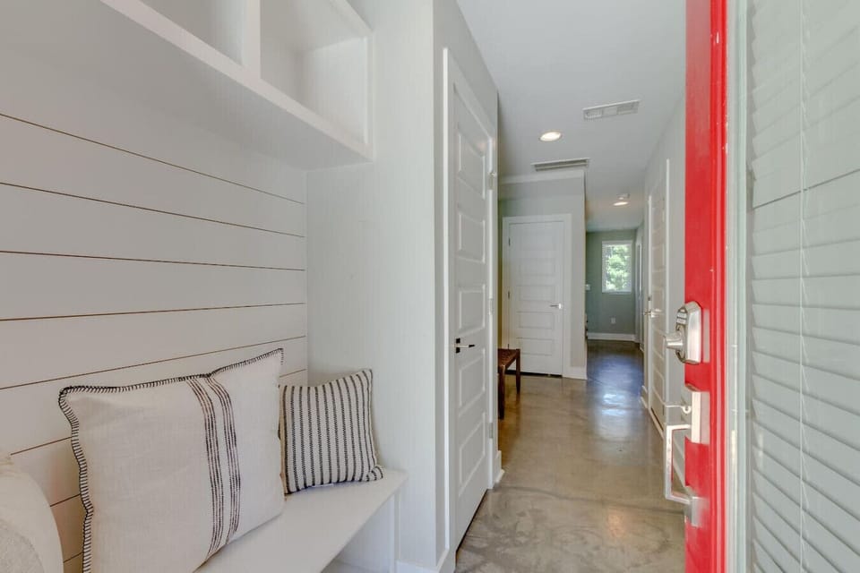 Full bathroom with a walk-in shower, marble-topped vanity, and tasteful framed artwork for a spa-like feel.