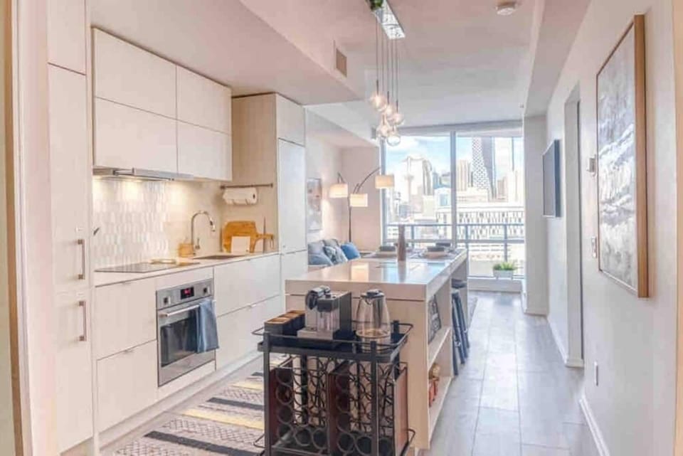 Sun-filled open layout with a gourmet kitchen and elegant dining island.