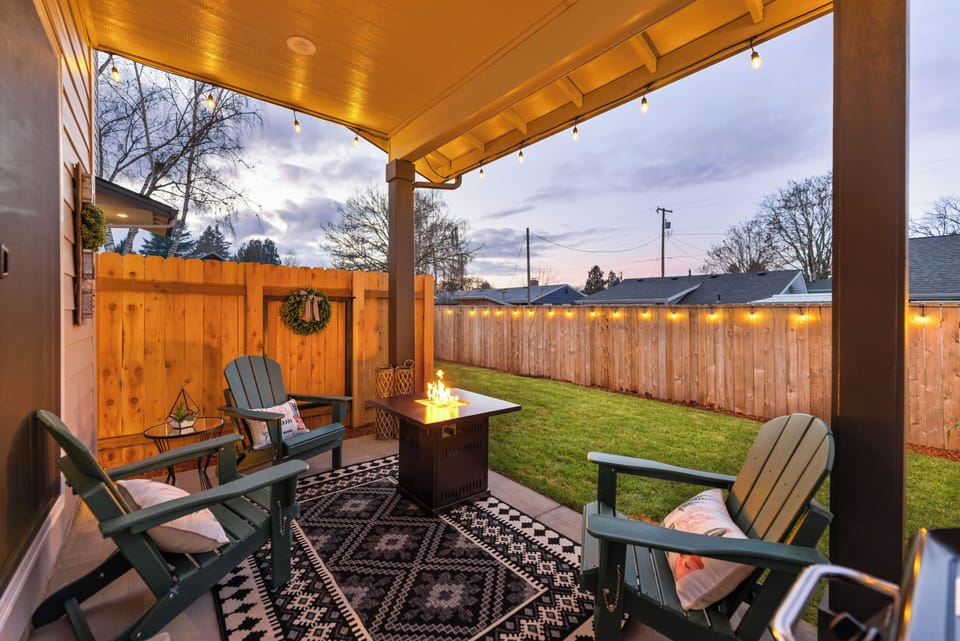 Enjoy the private backyard with propane grill, firetable, covered patio and more