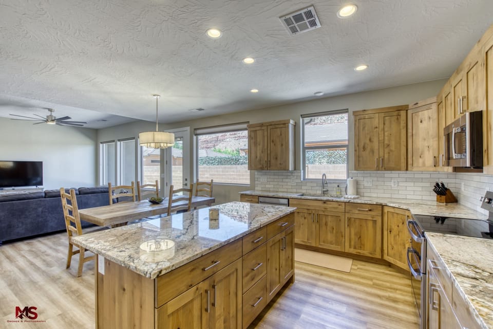Everything at your fingertips: the open layout connects the kitchen, dining, and living areas for effortless entertaining.