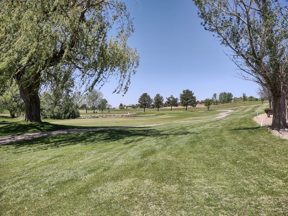 Looking north to the 18th green.  The cart path leads to the clubhouse.
