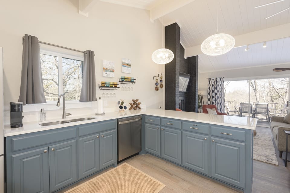 The unique floor plan offers an upper level kitchenette and bar space.