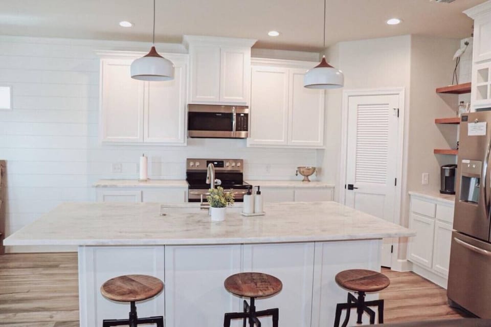 Bright kitchen boasting a central island, ideal for meal prep and entertaining.