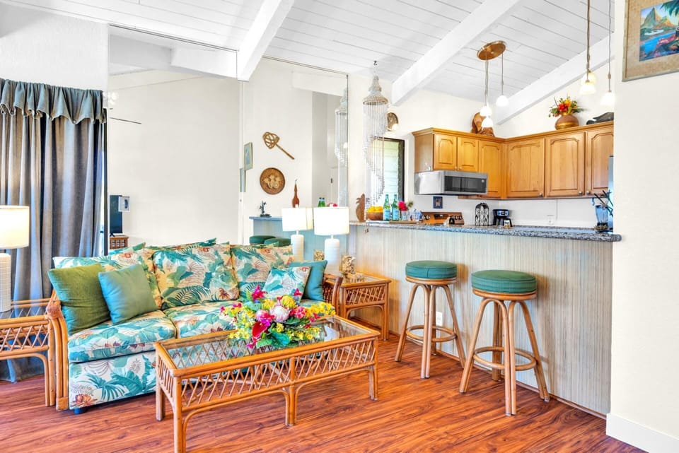 Cozy living area and breakfast bar with tropical flair, ideal for casual mornings or evening cocktails.
