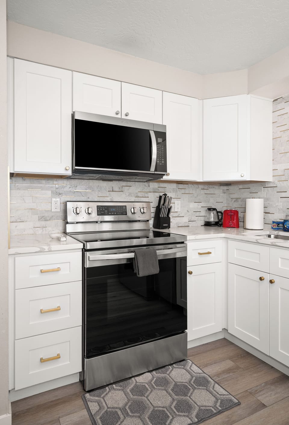 Bright modern kitchen with stainless appliances and stylish finishes
