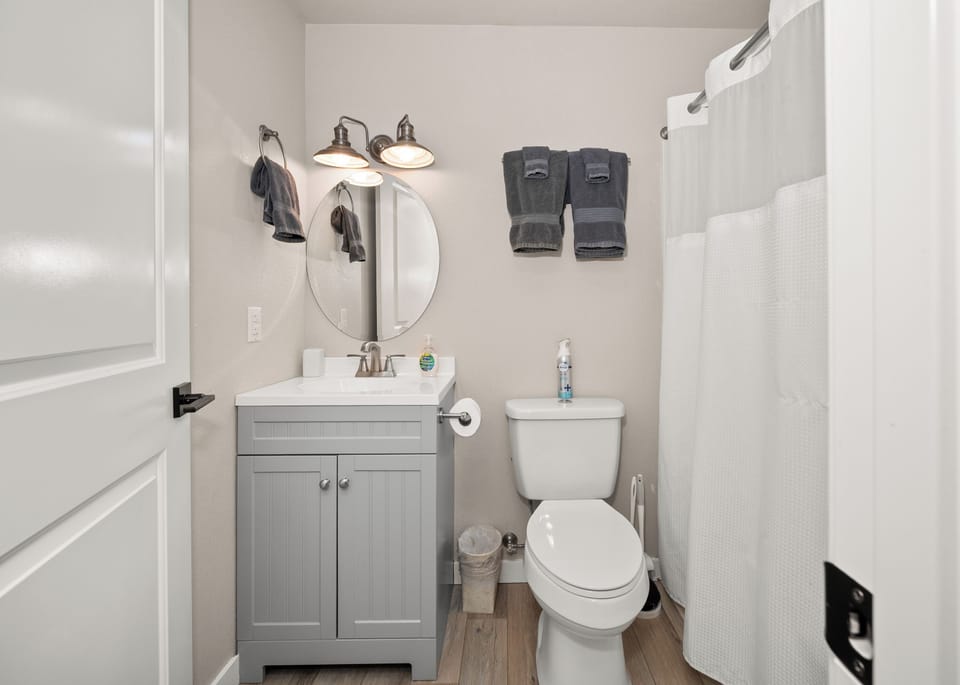 Bright modern bathroom with stylish vanity and full shower