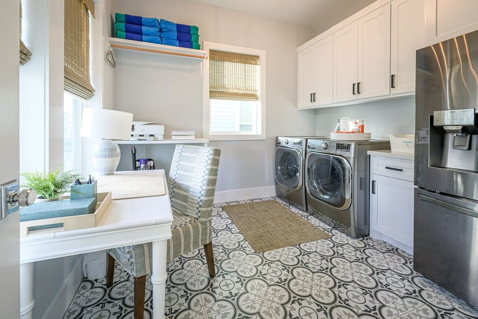 Workroom equipped with second fridge, desk, printer and washer/dryer