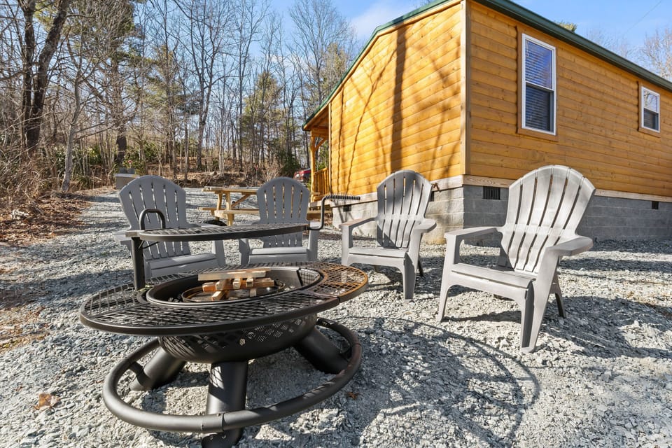 Enjoy the outdoors with a fire pit, attached grill, and picnic table!