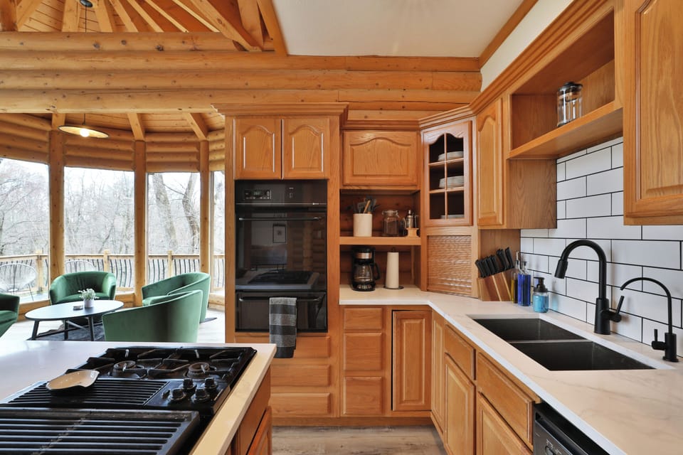 First floor full kitchen. Gas stovetop, sink, coffee maker, oven and dishwasher