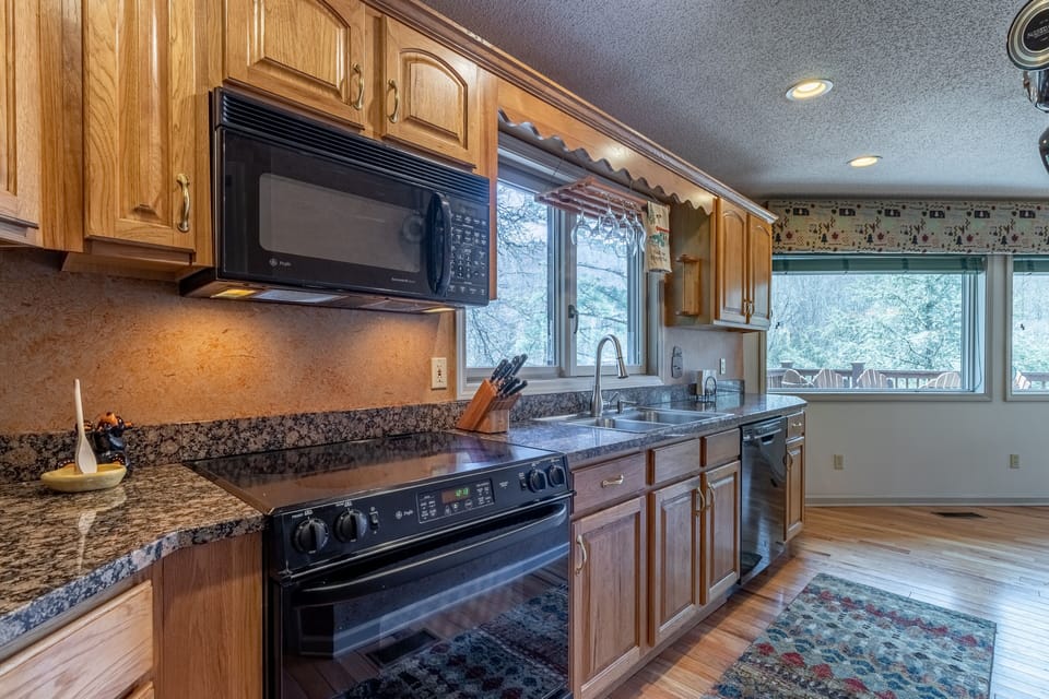 Kitchen with plenty of dishes, cookware, utensils, etc for your stay