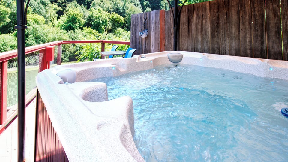 Hot tub with a birds eye view of the Russian River.
