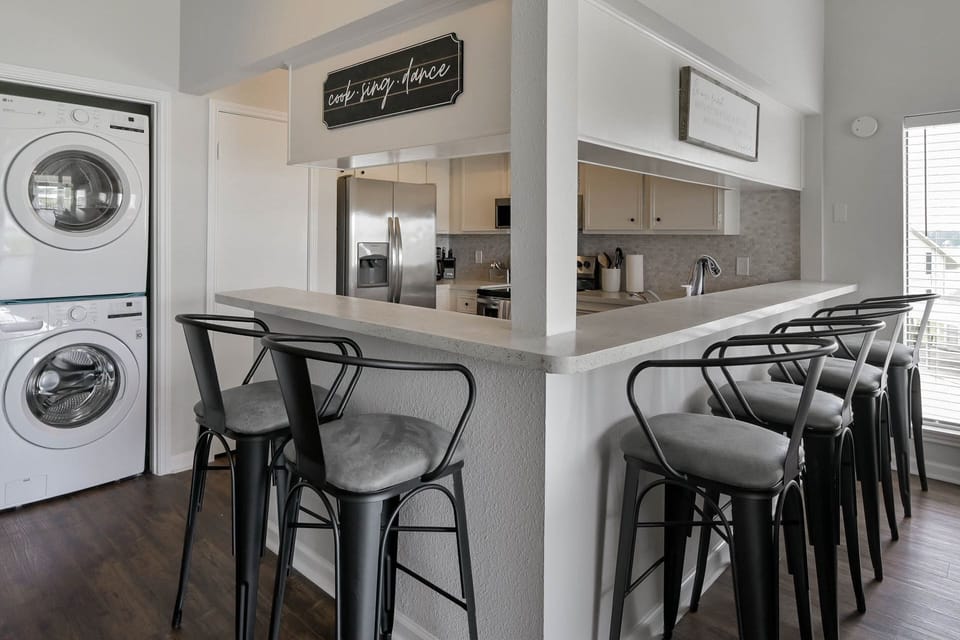 Plenty of seating at the kitchen bar with an additional table for 3