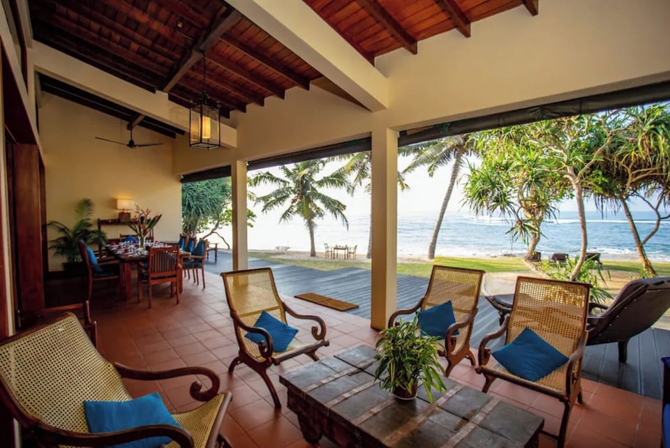 living and dining on the verandah. Ceiling fans available to keep you cool