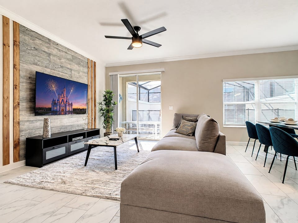 Spacious Living Room with Plush Sectional and Flat-Screen TV