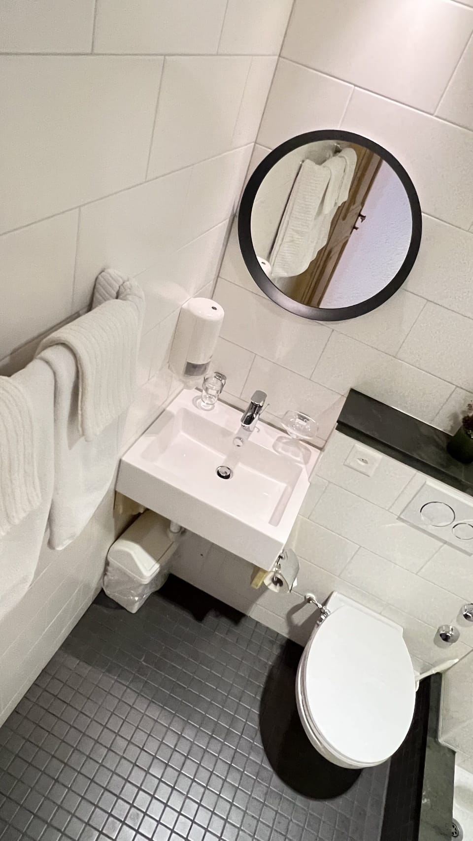 Shower, hair dryer, slippers, towels