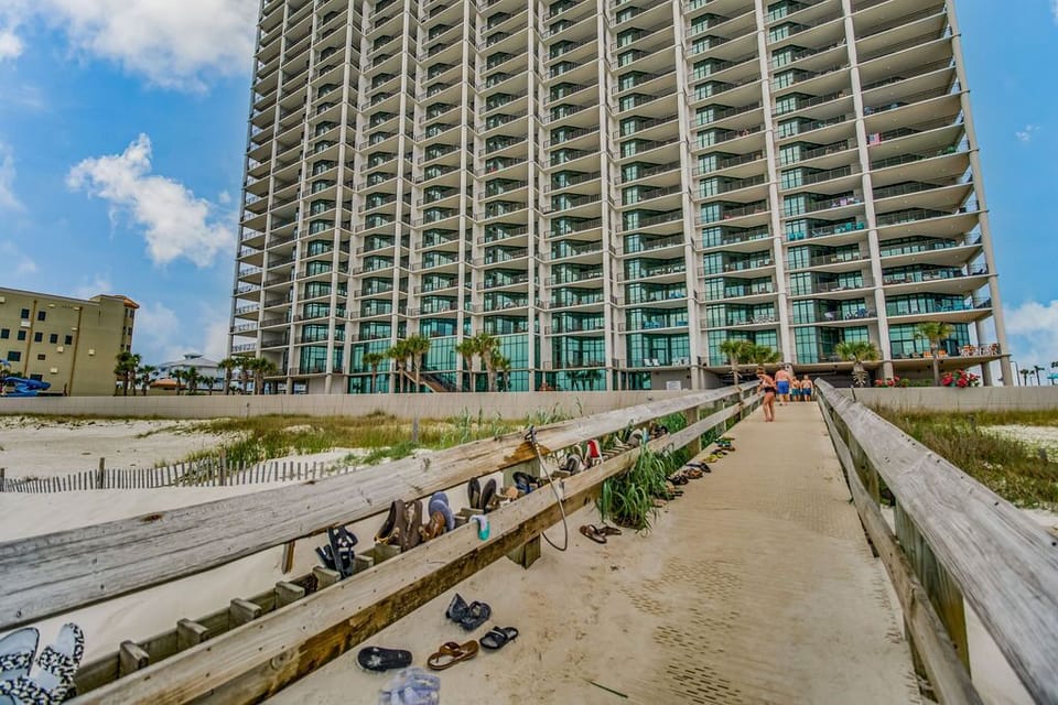 Private beach access with hoses and foot washing station.