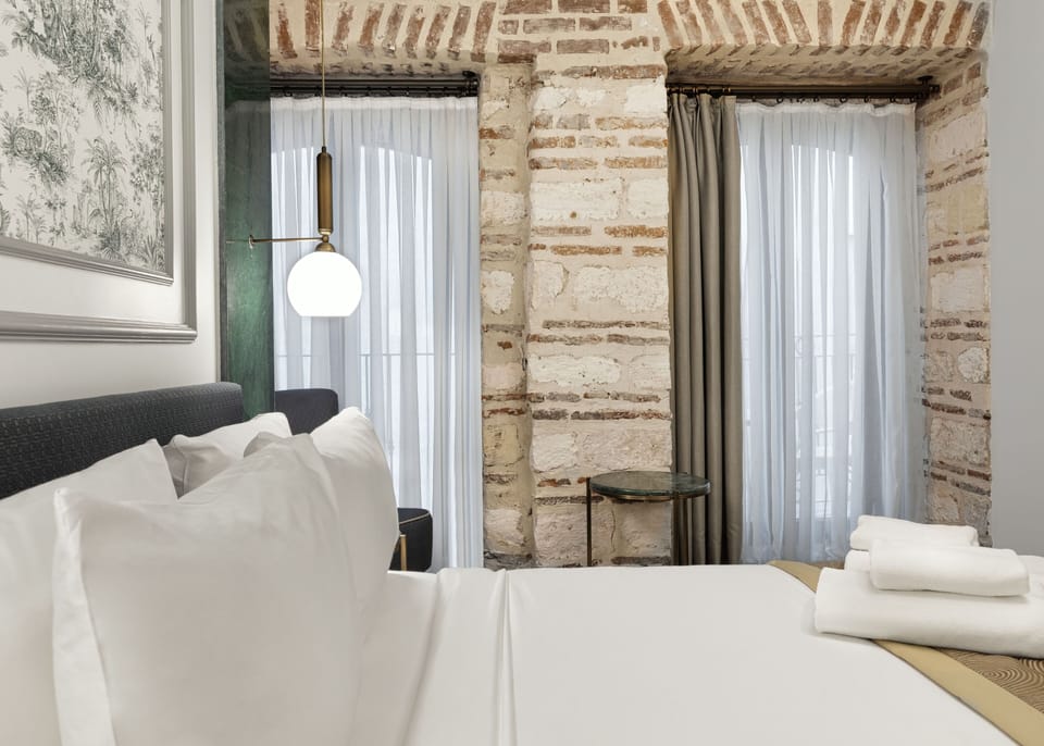 Superior Stone Room With Balcony | Premium bedding, in-room safe, desk, blackout drapes
