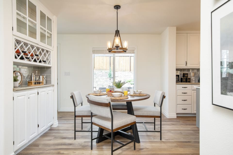 The eat-in kitchen chairs in the photo have been replaced with the same chairs that are in the formal dining room.