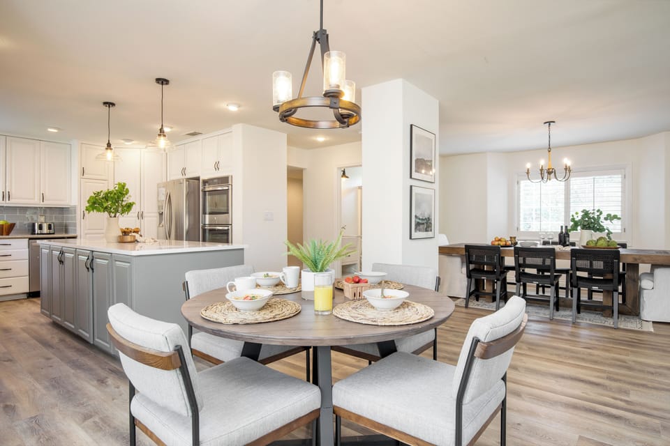 The eat-in kitchen chairs in the photo have been replaced with the same chairs that are in the formal dining room.