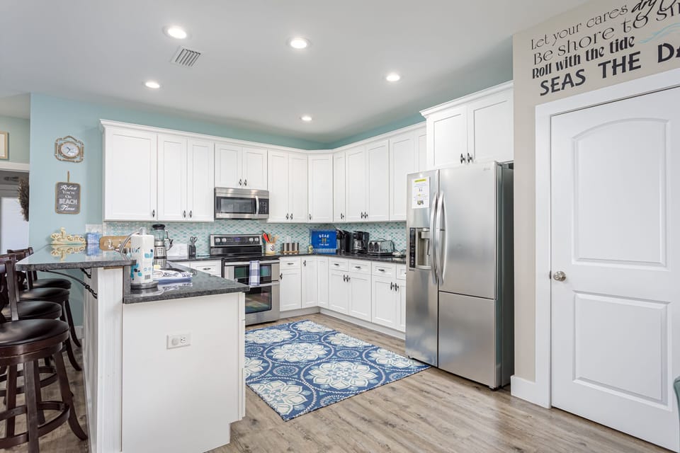 Cook for the whole group without bumping into anyone — two full kitchens, fully stocked.