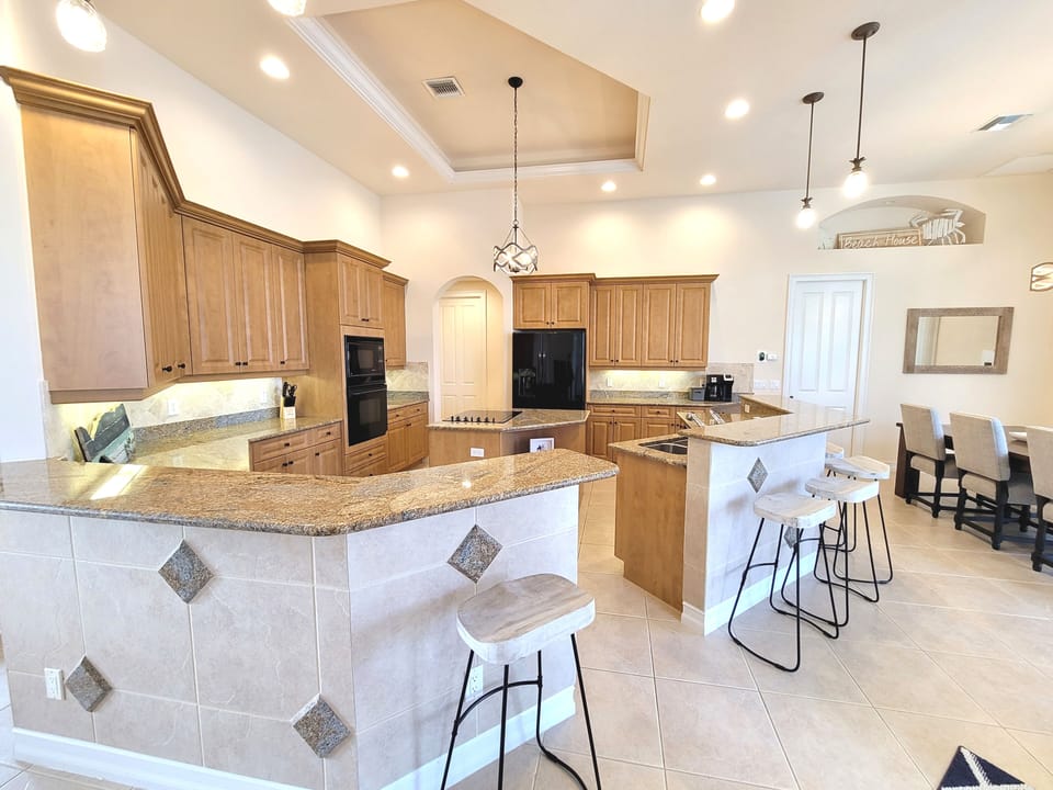 Fully functioning kitchen with additional seating along the counter