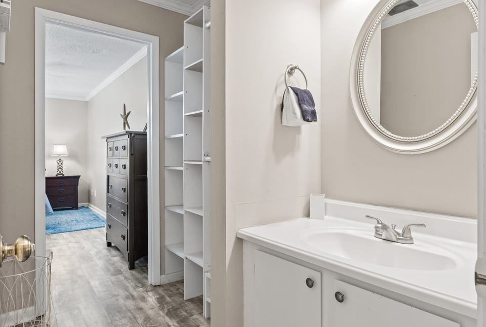 Convenient bathroom with walk-in tile shower for easy access.