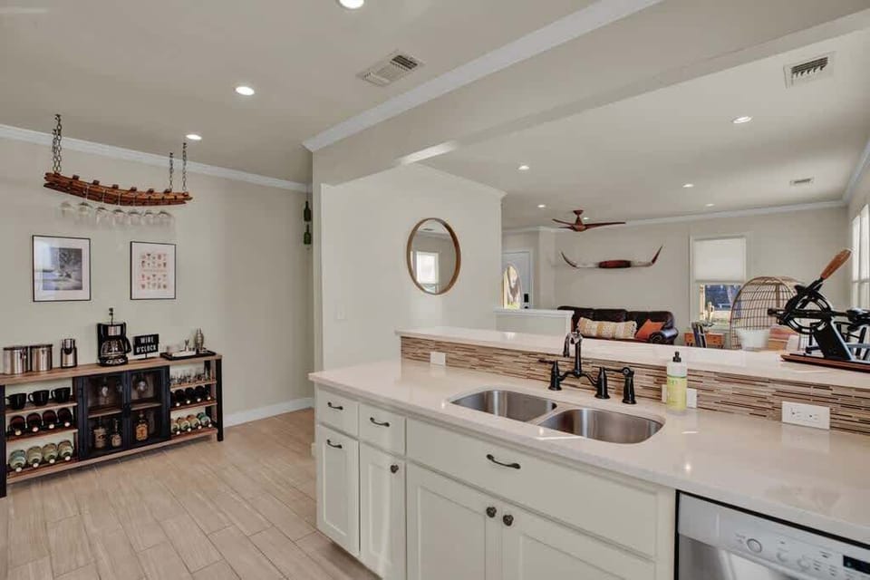 Fully stocked kitchen with all the pots, pans and utensils you'll need if you decide to stay in. Wine glasses and dish ware provided!