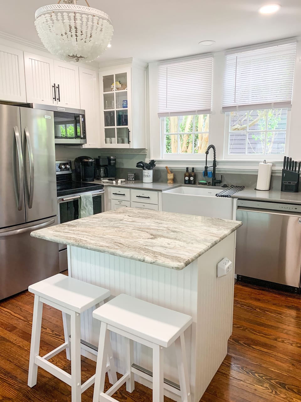 New appliances, marble kitchen island and quartz countertops.