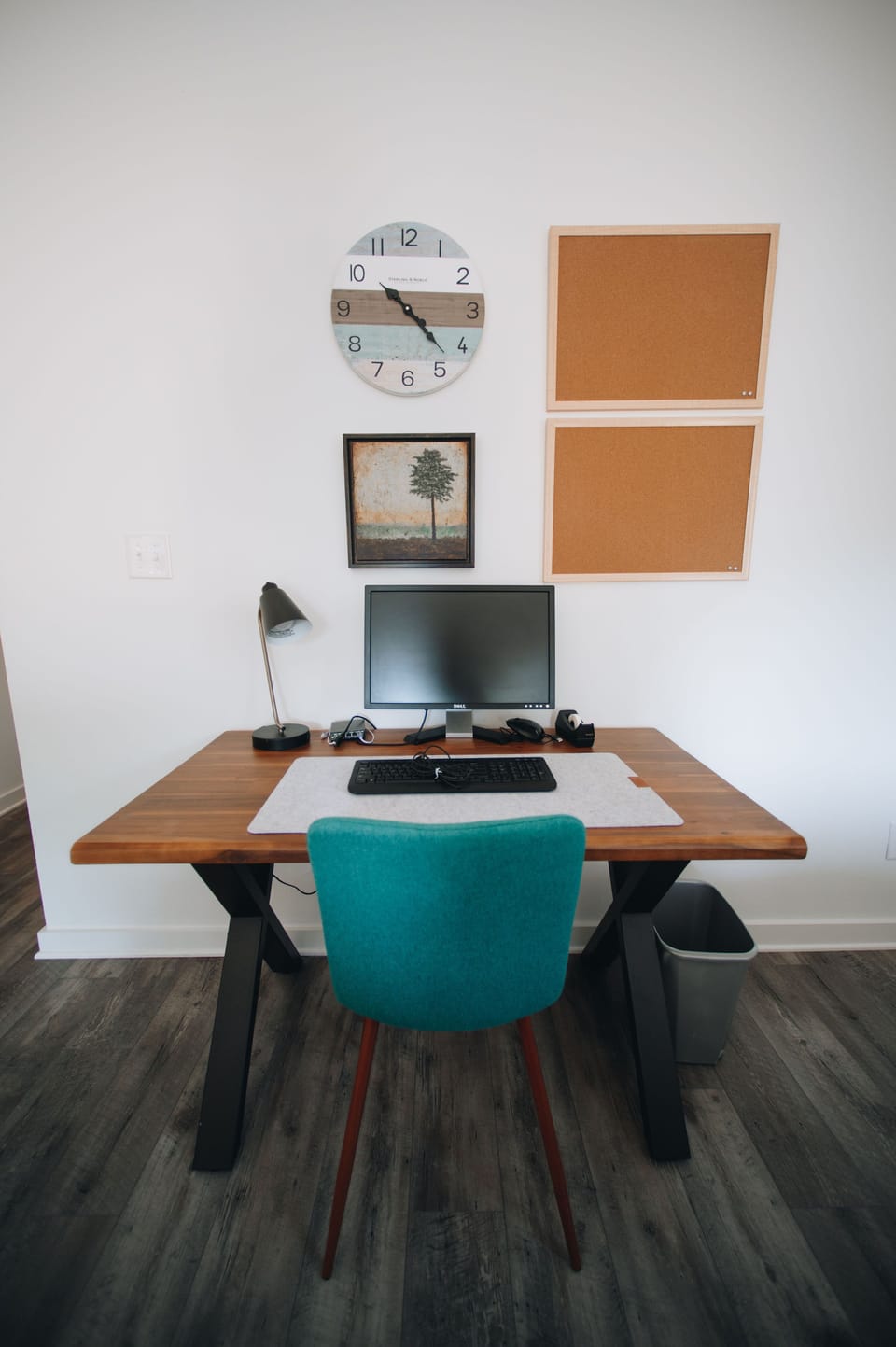 Hardwired work station with keyboard, monitor and charger.