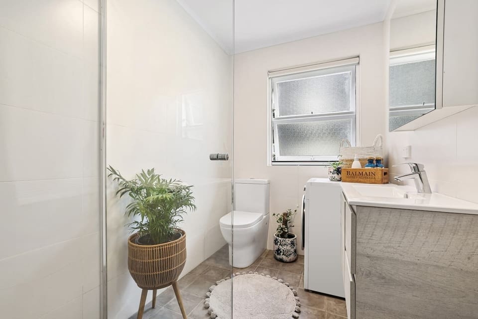The bathroom is bright and modern, with fluffy towels, hairdryer, shampoo, conditioner, gel etc, complete with washing machine.
