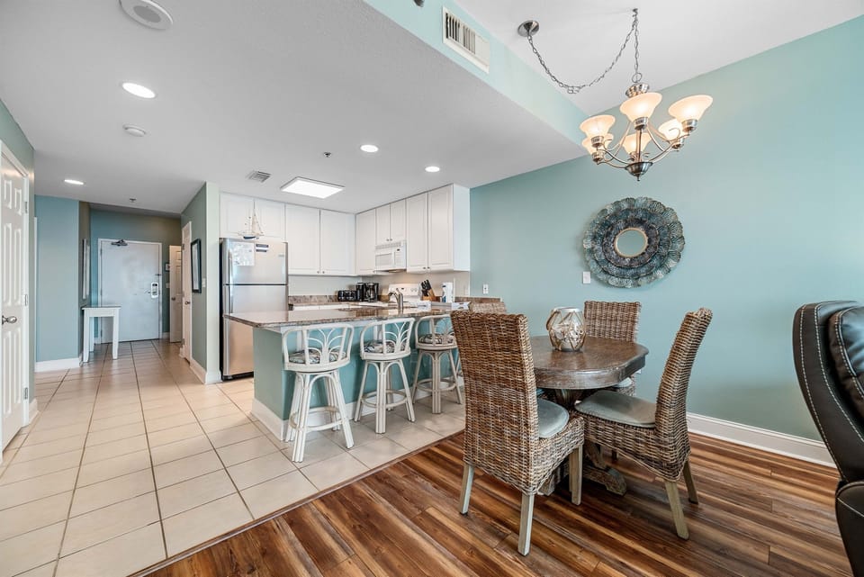 Dining area with 4 chairs and 4 barstools
