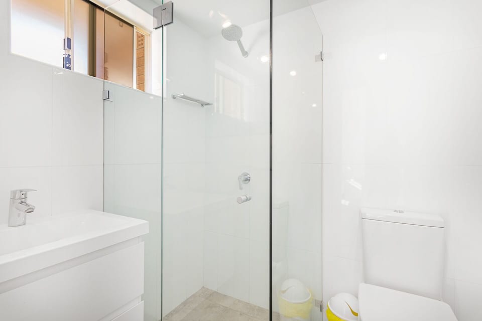Ensuite bathroom with shower and toilet.