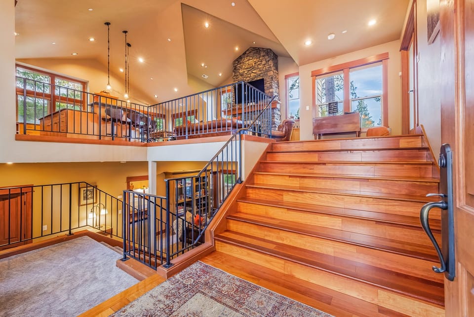 Stairway to the lower level, where Bedrooms 2–4 are located