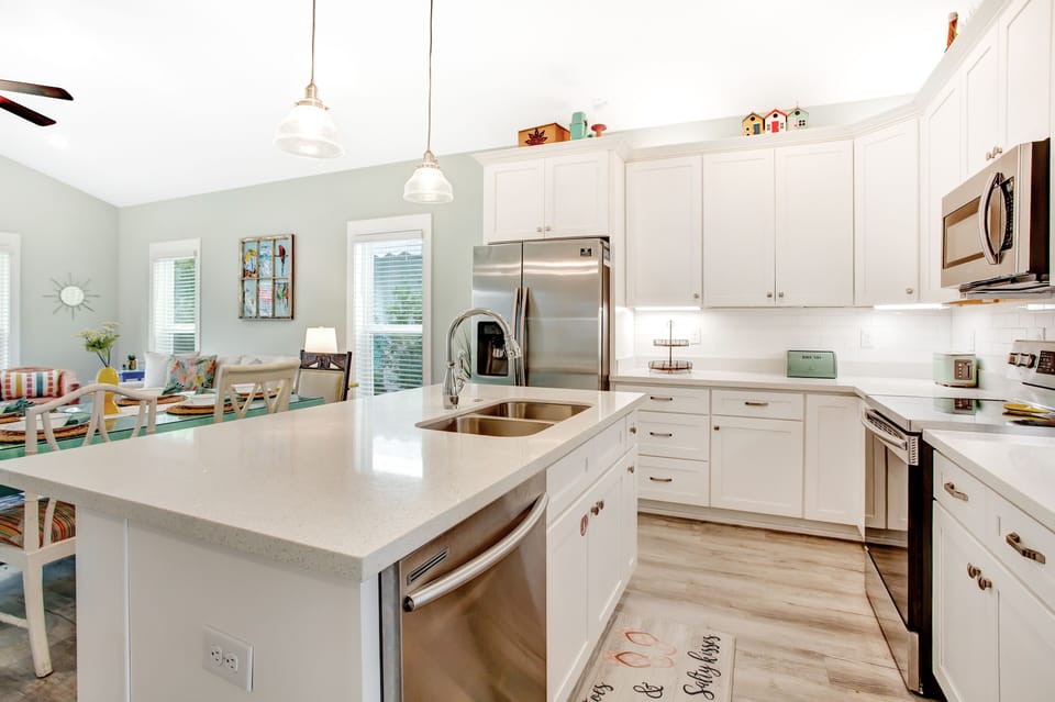 Kitchen is equipped with stainless steel appliances.