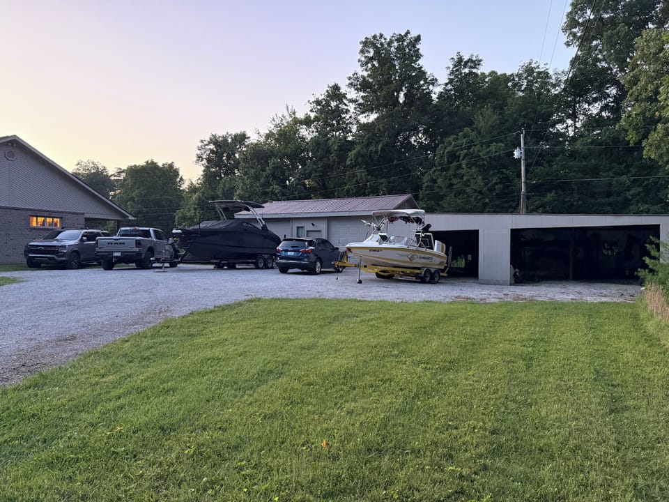 Driveway can fit multiple boats and vehicles. Boats shown are 24 Ft and 22.5 Ft